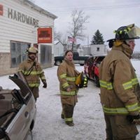 three firefighters walking in snow