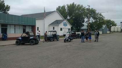 white building with four wheelers on street