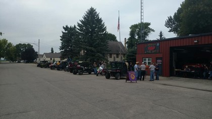 crowd outside of red building